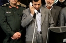 Iranian President Mahmoud Ahmadinejad receives news of the successful 'Omid' launch