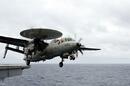 An E-2C Hawkeye assigned to the Black Eagles of Airborne Early Warning Squadron (VAW) 113 launches from the flight deck of the aircraft carrier USS Ronald Reagan (CVN 76). Credit: US Navy/Mass Communication Specialist 2nd Class Joseph M. Buliavac