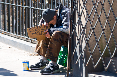 homeless man with sign