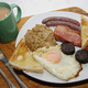 The full Spanglish breakfast: mealy pudding, bacon, black pudding, sausages, fried egg, toast