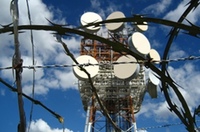 Barbed wire surrounding communications tower