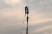 Engineers fitting antenna heads