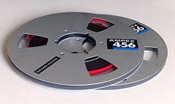 Audio tape reels feature flanges to hold the tape in place and protect it