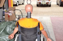 Crash test dummy in a wheel chair at the TRL