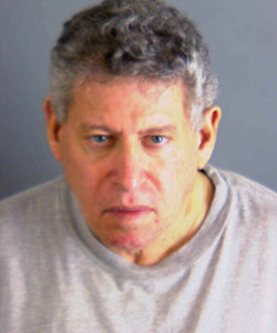 Police mugshot of Gad Zamir wearing gray t-shirt