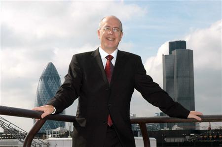 Former BetonSports executive David Carruthers wearing suit and glasses. NatWest Tower and "Gerkin' in background 