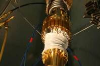 Shot of the D-Wave chip holder - a robotic looking contraption