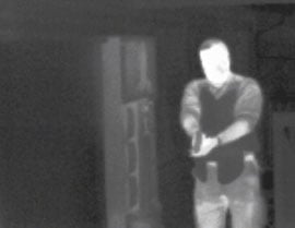 Thermal image of man with gun