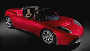 promo shot of red Tesla Roadster