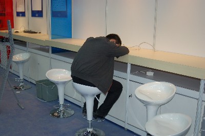 A man who has fallen asleep at an IDF booth