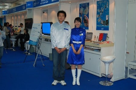 Man and women at IDF with Intel logos on