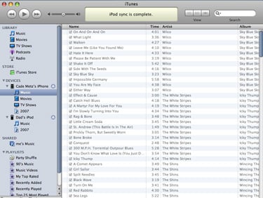 Screenshot of iTunes with library showing contents of iPhone music as gray