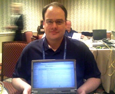 Picture of Rob Graham with notebook computer sitting on his lap