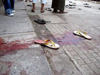 A picture of blood-stained sandals on the streets of burma today