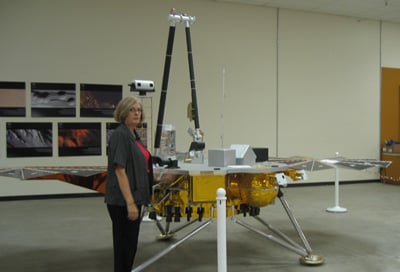 A copy of the Phoenix lander, alongside Sara Howlands. Credit: Wendy M. Grossman