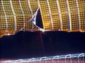 Ripped solar array, courtesy NASA