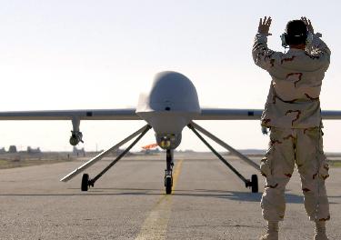 A Predator deals with Senior Airman Robert Mascorro in Iraq