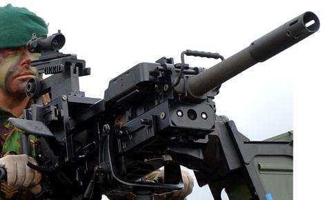 A British commando demos a 40mm auto-launcher