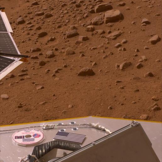 View of Phoenix on Mars showing US flag and mini-DVD