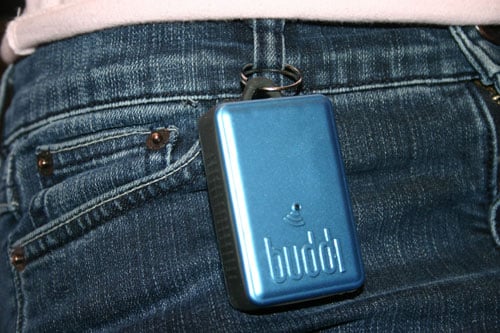 credit card-sized buddi attached to belt loop of denim jeans