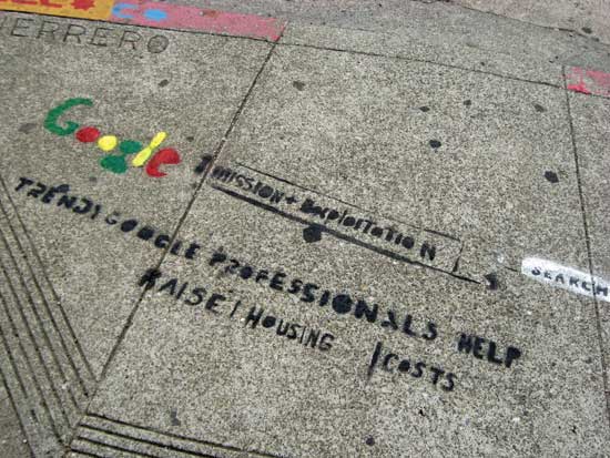 Stencil that says "Trendy Google professionals help raise housing costs."