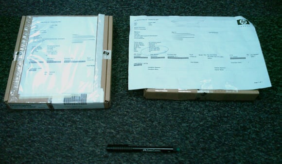 The two boxes each containing a replacement DIMM