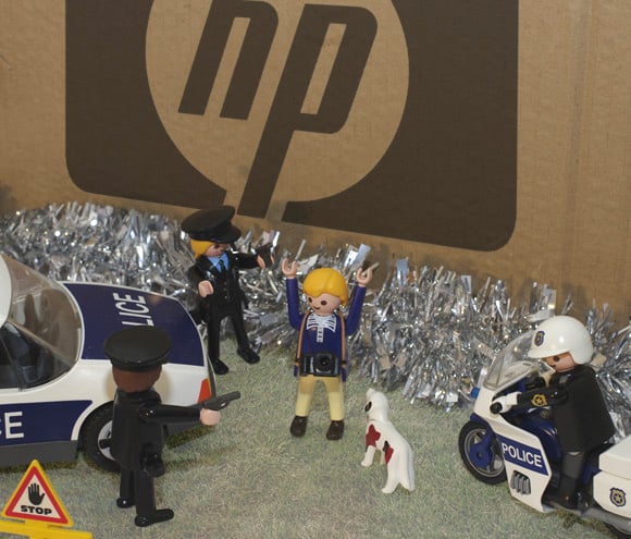 Police tackle photographer at foot of enormous HP box