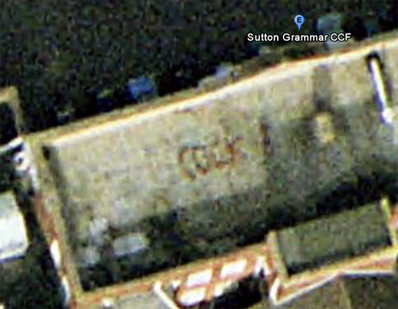 12ft cock written in bricks on roof of Sutton Grammar School