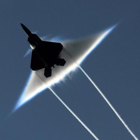 An F-22 Raptor carries out a supersonic flyby