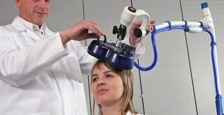 A subject undergoing magnetic brain stimulation