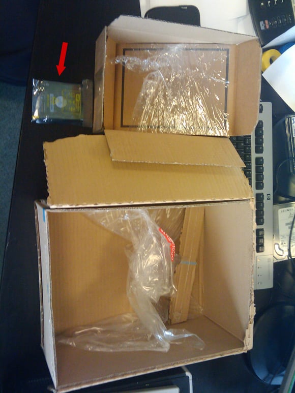 Two very large boxes containing one small drive
