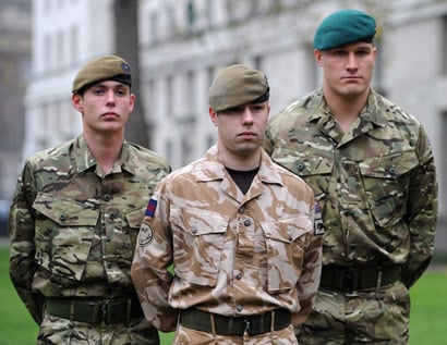 British soldiers model the new MTP (left and right) and existing desert kit (centre). Credit: British Army