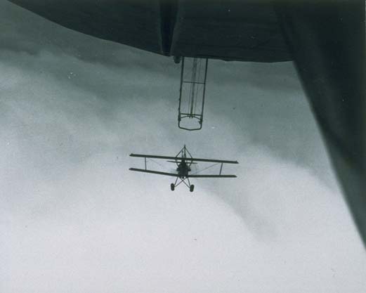 A Curtiss Sparrowhawk fighter coming in for hook-on to USS Macon's trapeze