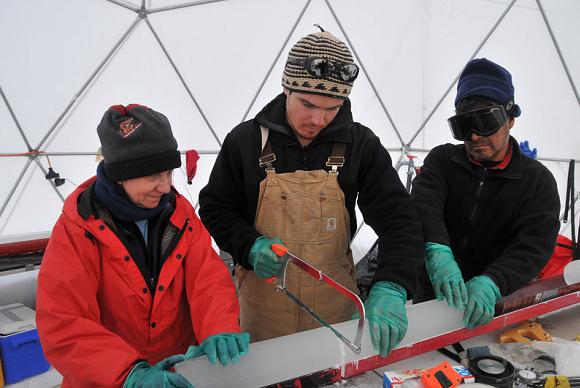 Ellen Mosley-Thompson and colleagues saw up ice cores at the Bruce Plateau camp. Credit: Ellen Mosley-Thompson, OSU