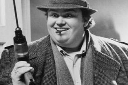 B&W film still of man with electric drill.