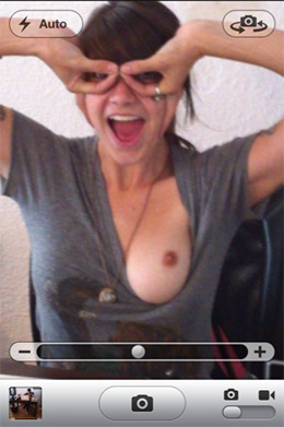 Screen grab from iPhone 4 showing young lady with exposed breast