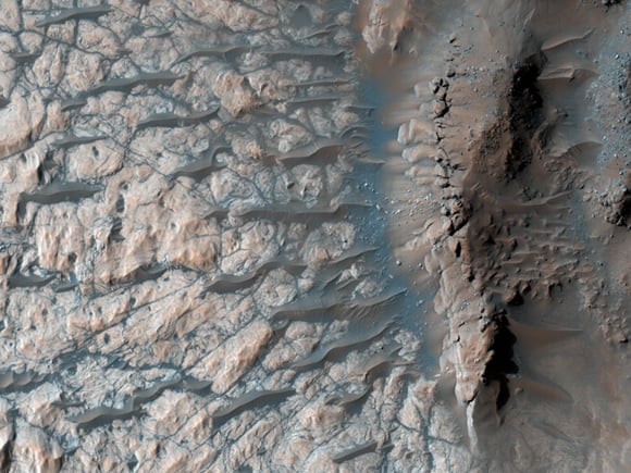 The floor of a large impact crater in the Martian southern highlands, north of the giant Hellas impact basin. Credit: NASA/JPL/University of Arizona