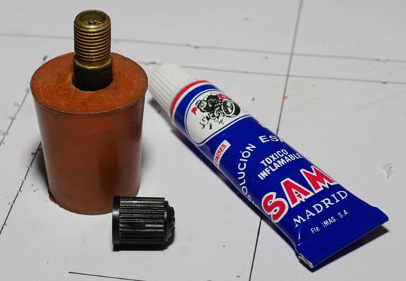 Bicycle valve glued into rubber bung