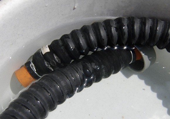 Testing the tube for leaks in a bowl of water