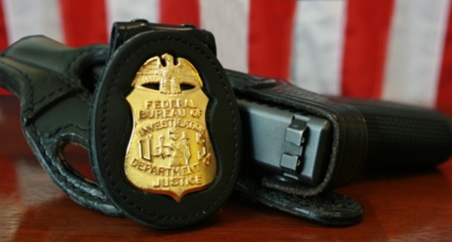 FBI badge and gun