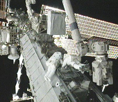 Tracy Caldwell Dyson (left) and Doug Wheelock during today's spacewalk. Pic: NASA TV