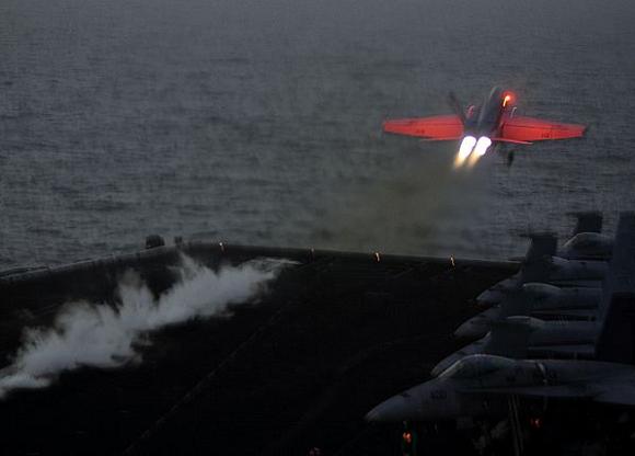 An F/A-18E Super Hornet assigned to the Pukin Dogs of Strike Fighter Squadron (VFA) 143 catapults from the flight deck of the Nimitz-class aircraft carrier USS Dwight D. Eisenhower (CVN 69). Credit: US Navy/Mass Communication Specialist 3rd Class Chad R. Erdmann