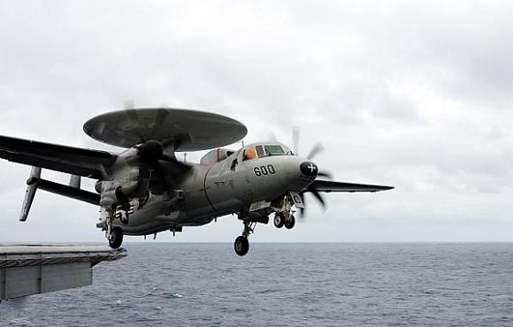 An E-2C Hawkeye assigned to the Black Eagles of Airborne Early Warning Squadron (VAW) 113 launches from the flight deck of the aircraft carrier USS Ronald Reagan (CVN 76). Credit: US Navy/Mass Communication Specialist 2nd Class Joseph M. Buliavac