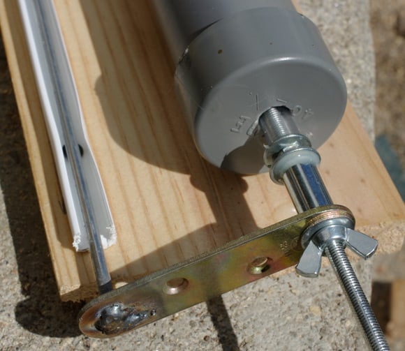 The plunger rod attached to the release rod by a bracket