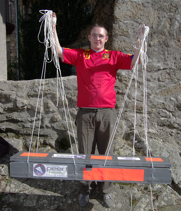 Rui holding aloft the completed main payload box