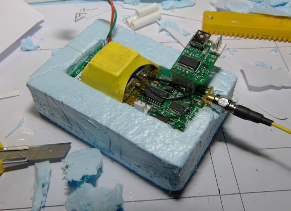 The GPS/APRS board mounted in styrofoam