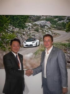 handshake for Tesla Panasonic deal