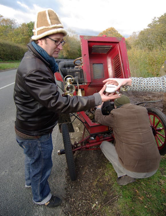 John grabs a coffee while William checks the car