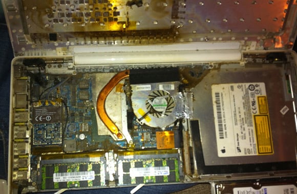 Tar-encrusted Macbook motherboard