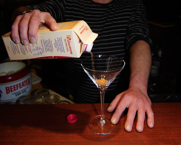 Pour brown sugar into a cocktail glass